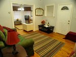 The large foyer area includes a second sofa-bed for additional persons.