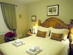 Main Floor Suite - First queen bedded Bedroom